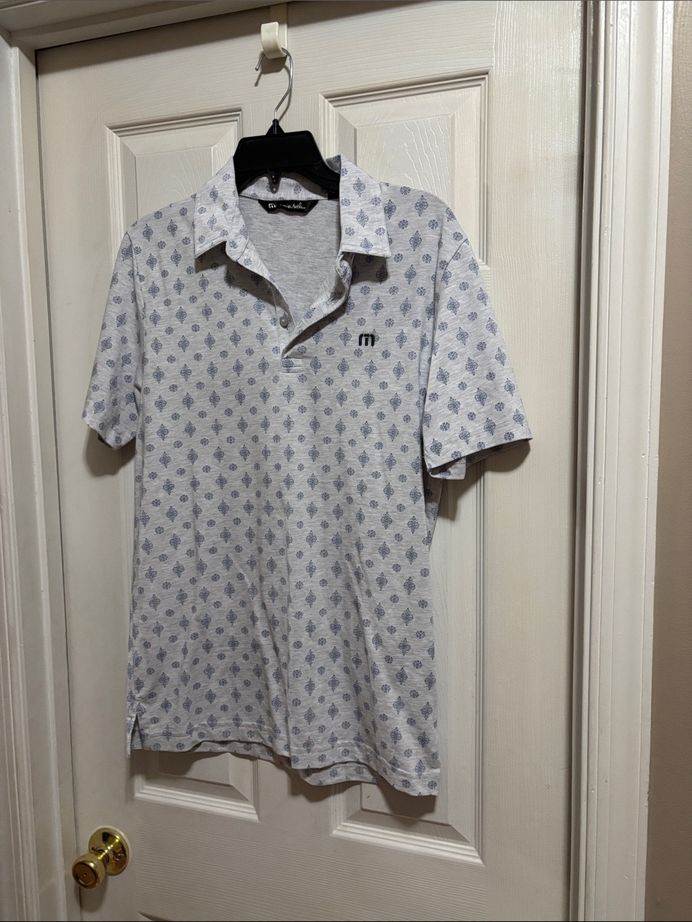 Travis Mathew White Polo with Blue Motif Print